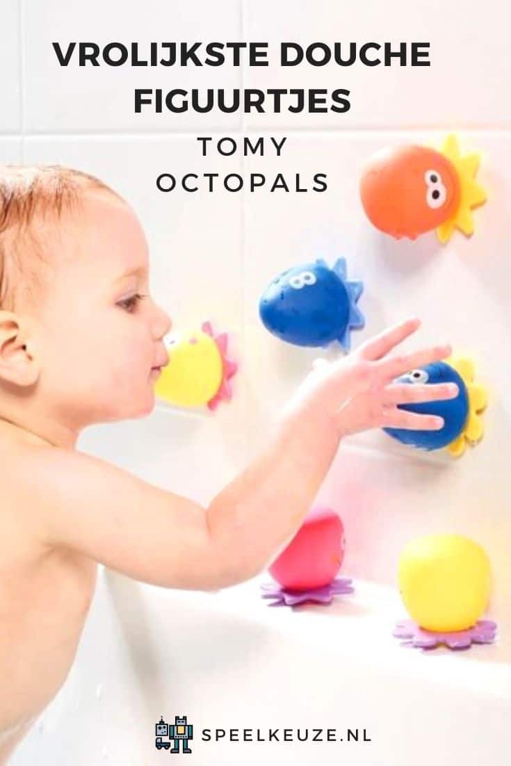 Boy playing in the shower with Tomy octopals with suction cups