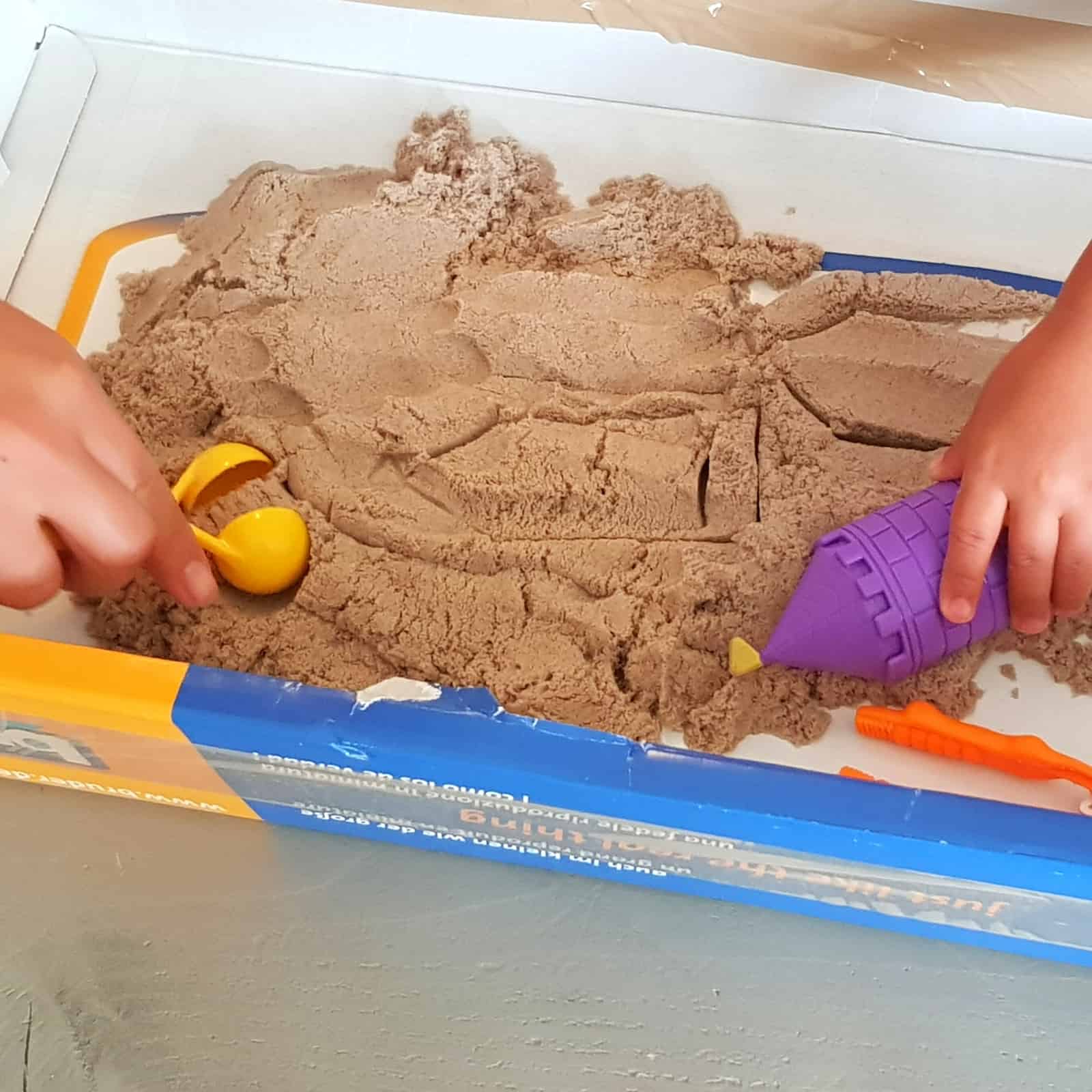 DIY kinetic sand play area from a box