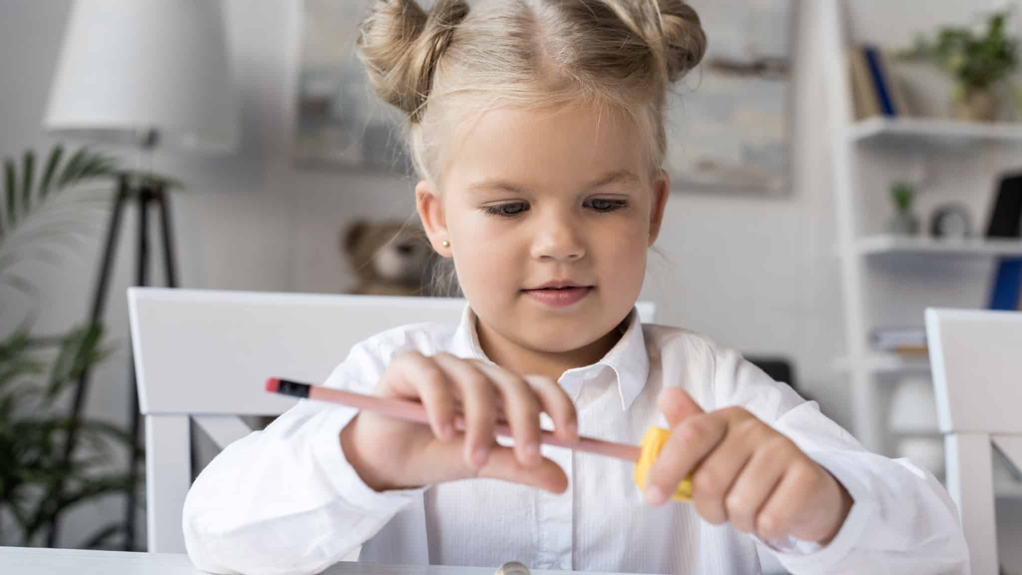 From when can a child properly hold a pencil?