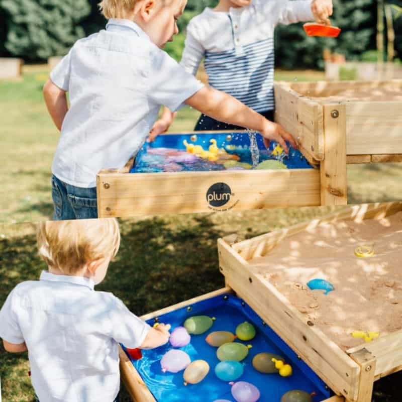Children play with the Plum Sandy Bay water table