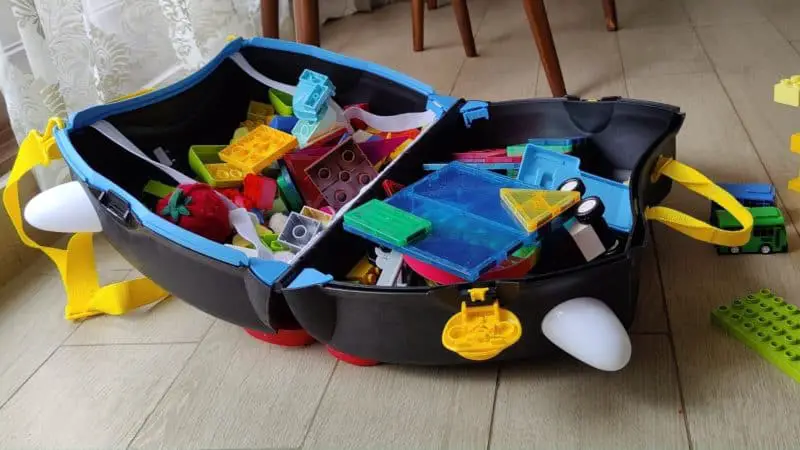 An open Trunki with toys in it