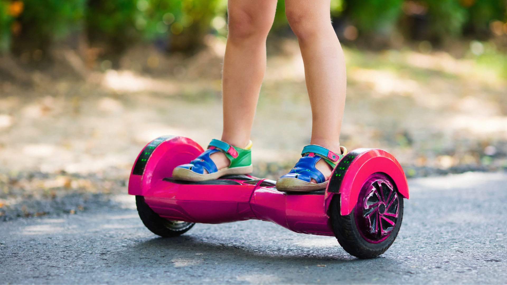 Pink hoverboard with baby on it