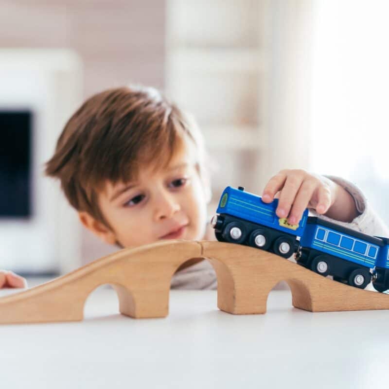 What do children learn from playing with a train track